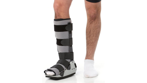 man with an ankle brace